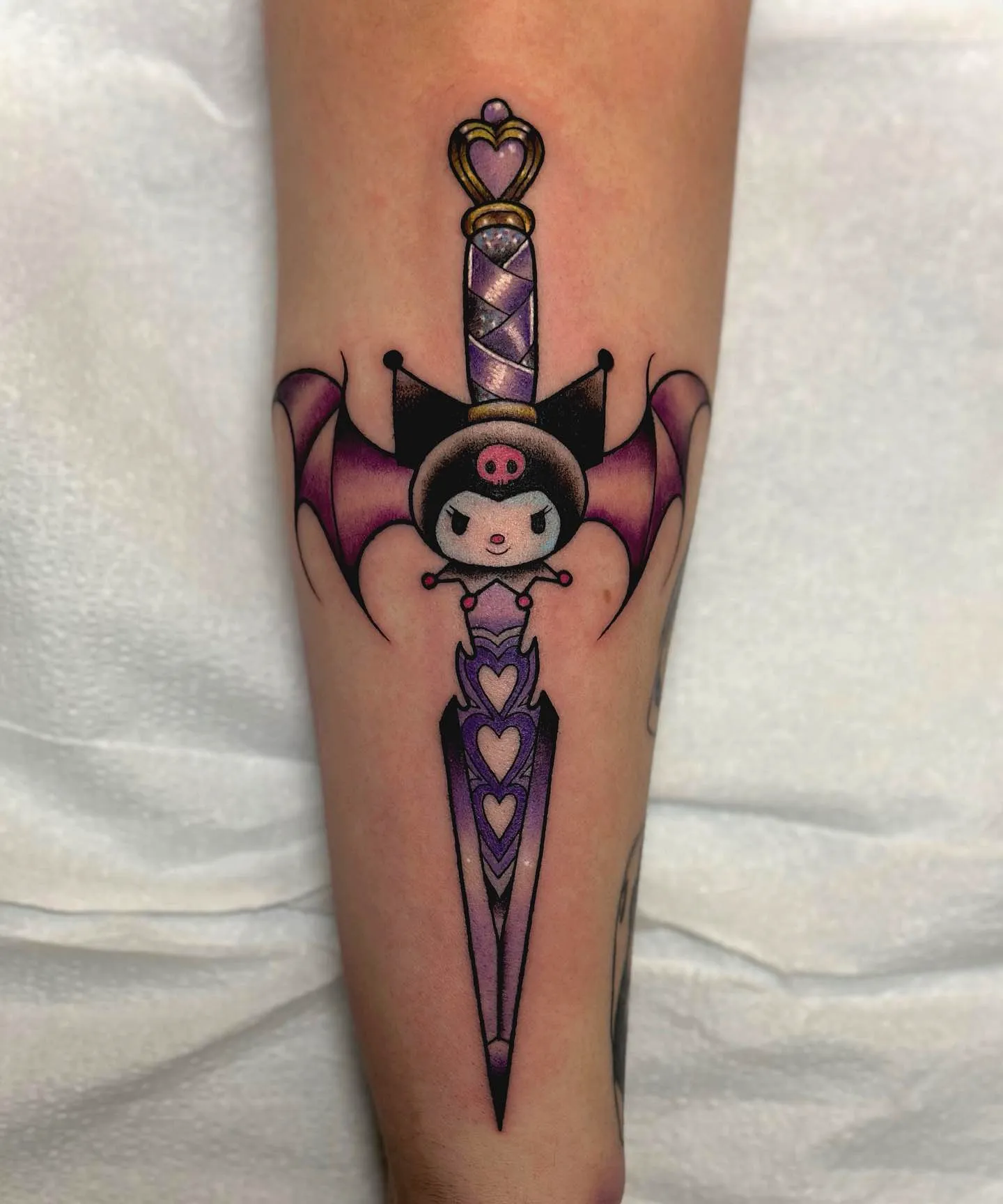 Whimsical Bat Wings Arm Tattoo