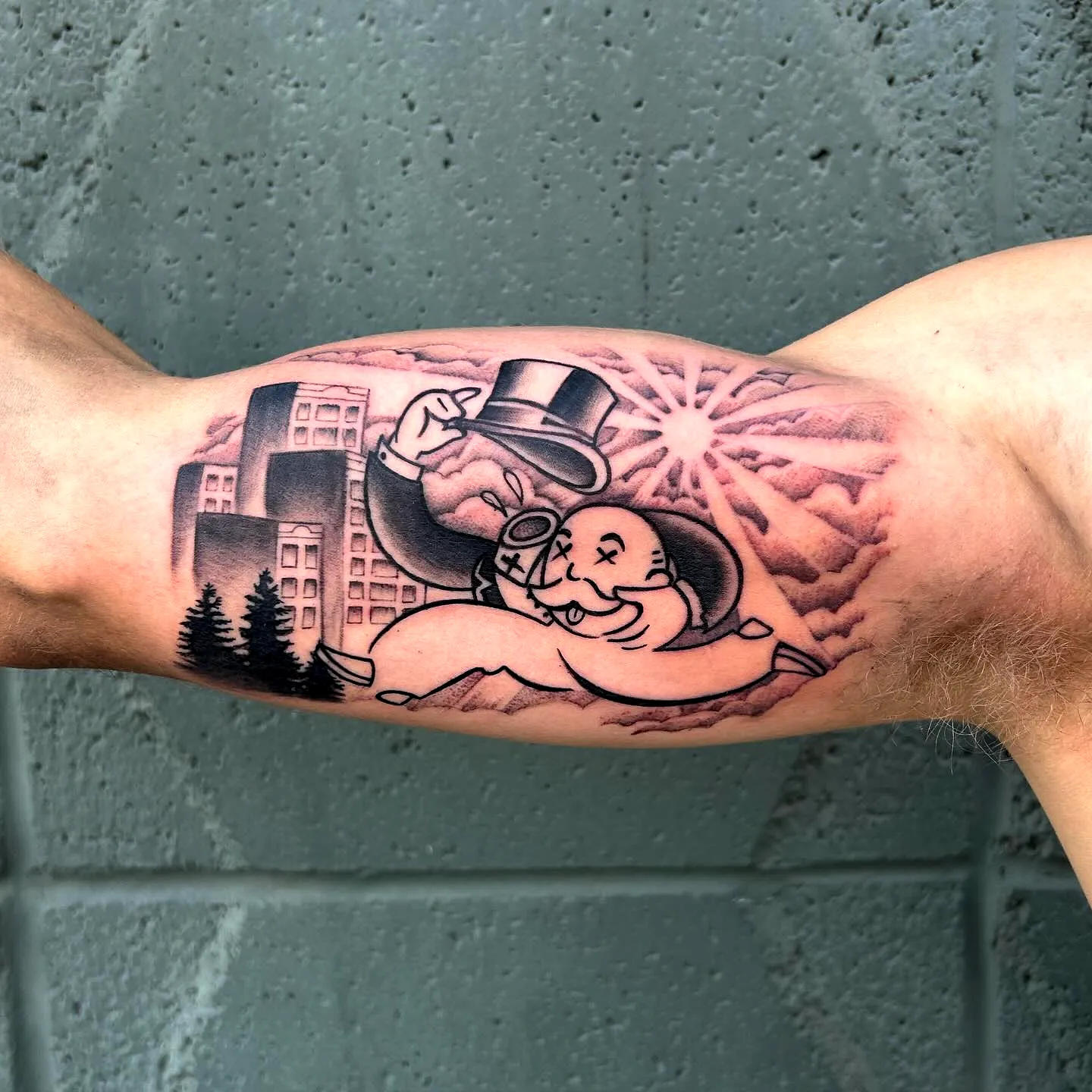 Whimsical Character Arm Tattoo