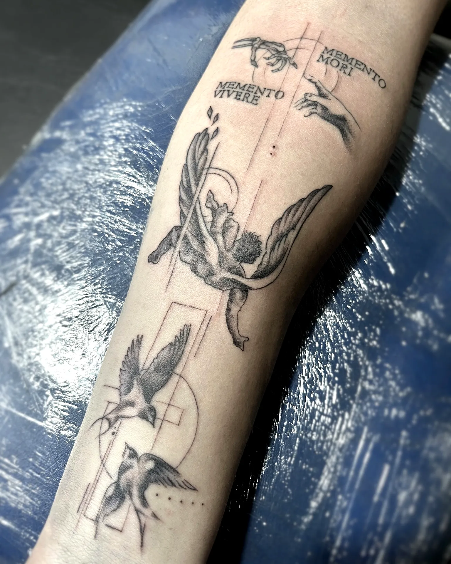 Winged Angel Forearm Tattoo in Black and Grey
