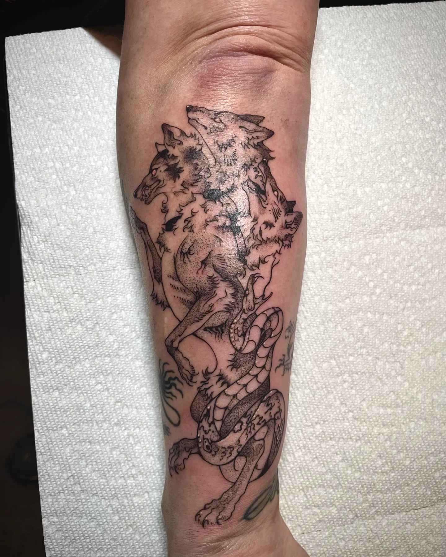 Wolves Serpent Forearm Tattoo