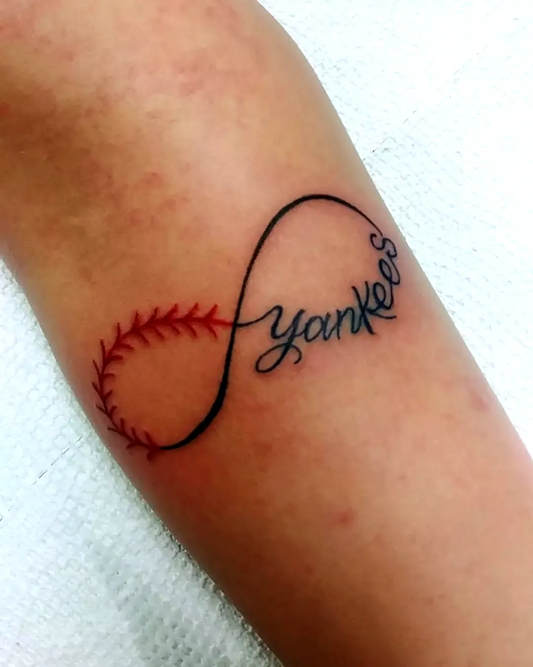Yankees Forearm Tattoo with Infinity Stitch